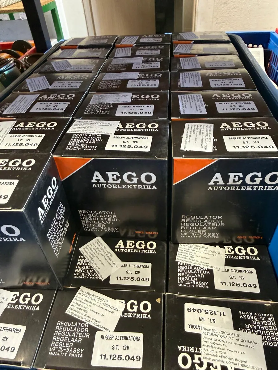 Boxes of AEGO spare parts on a shelf