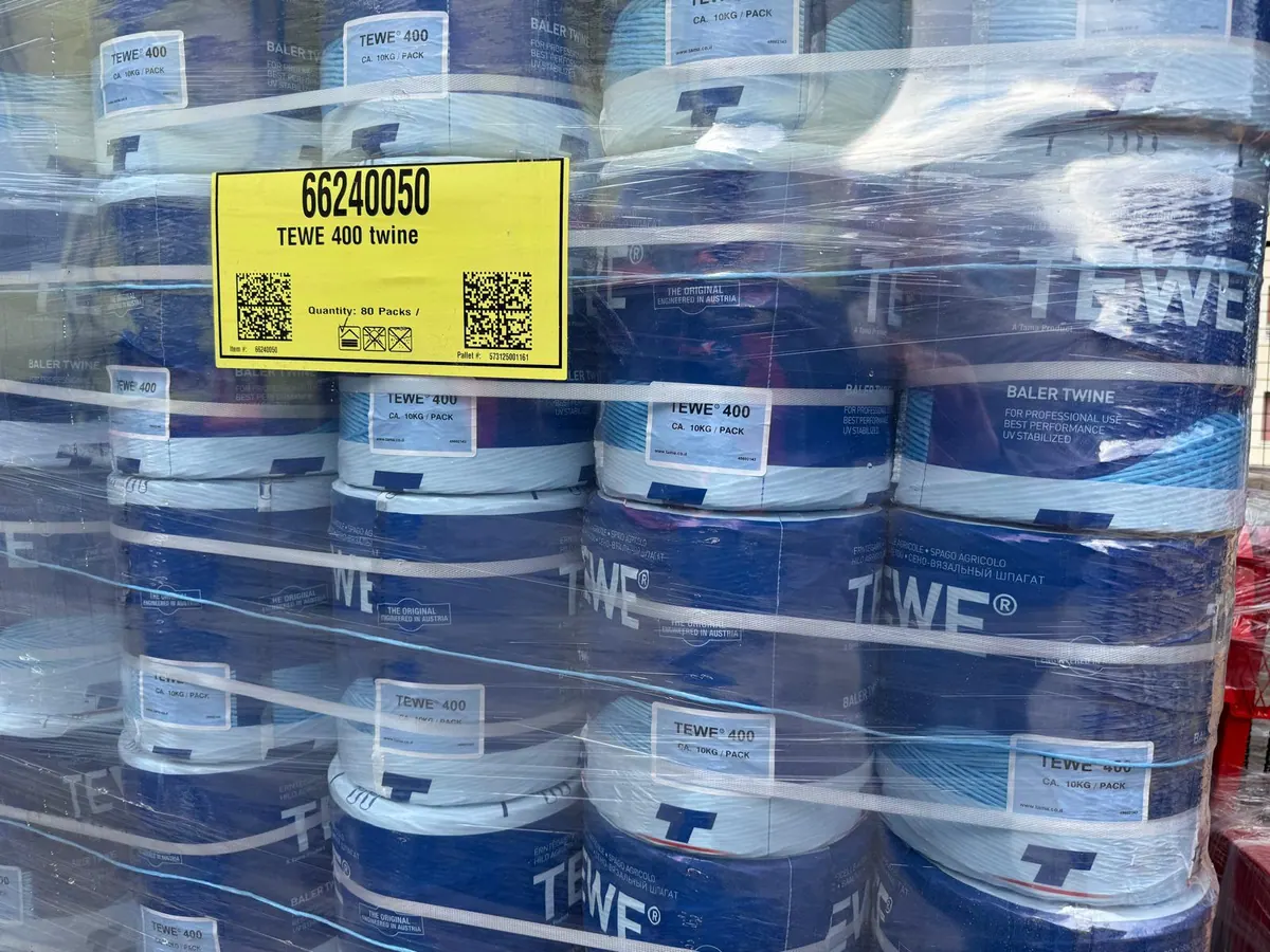 Canisters of TEWE fluid with a price label