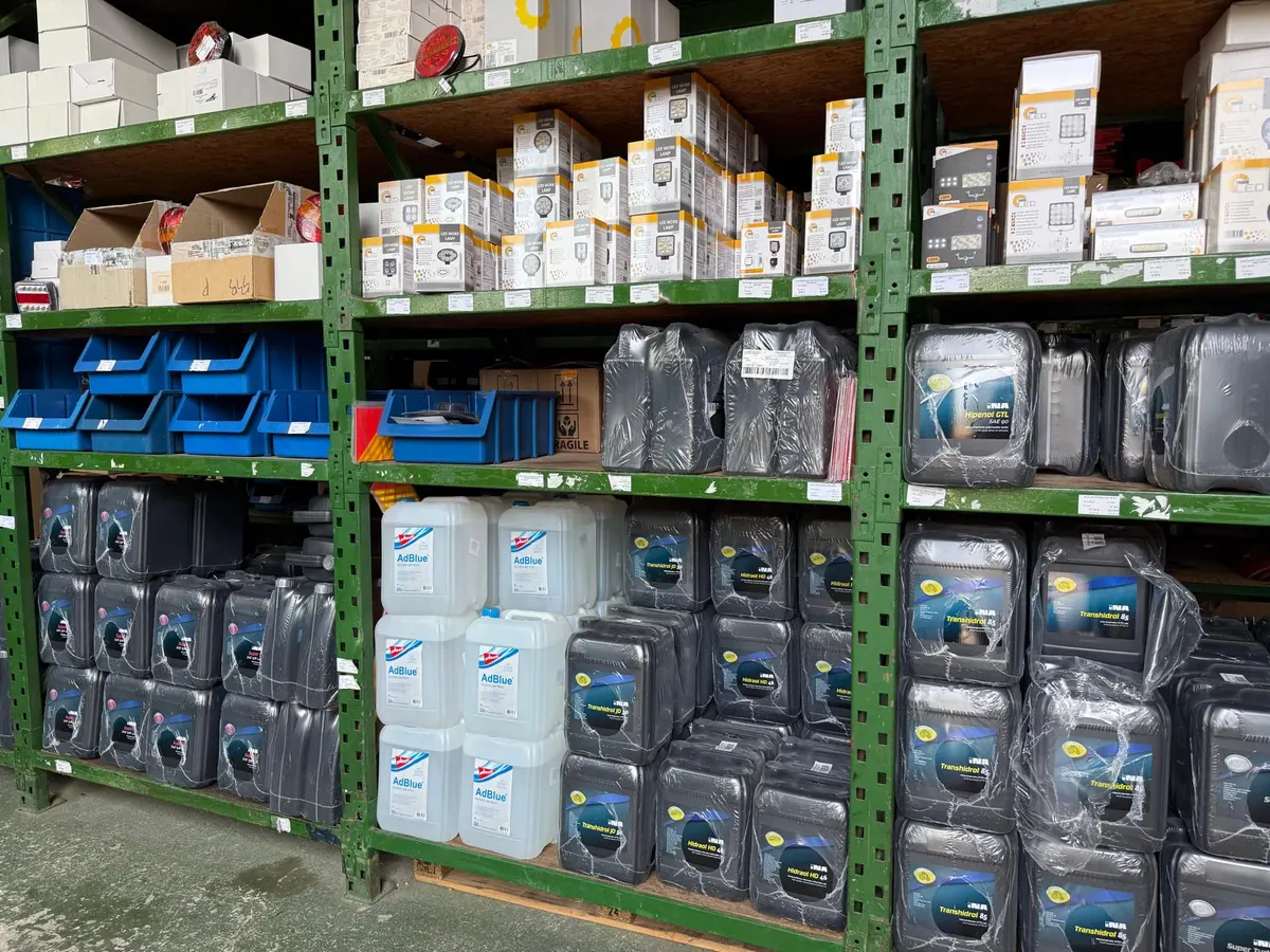 Shelves with oil canisters in the warehouse